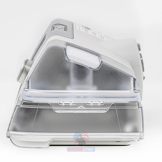 A ResMed AirCurve 10S BiPAP machine with a carry case, water chamber, and new heated tubing. The power supply is visible but the mask is not included.